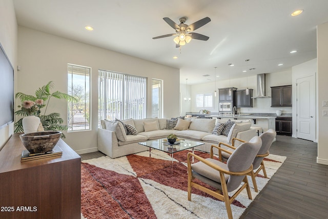 living room with dark wood-style floors, recessed lighting, baseboards, and a ceiling fan