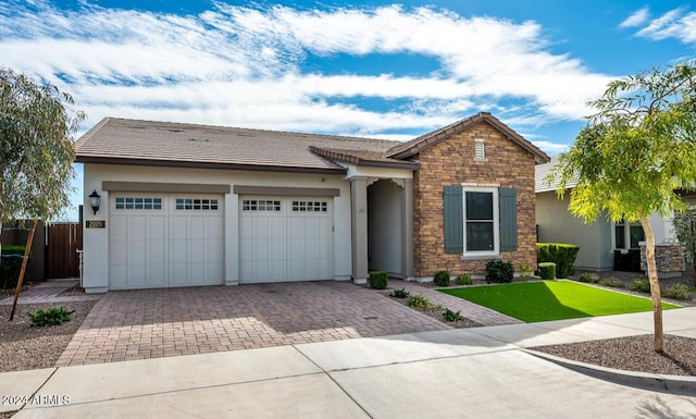 ranch-style house featuring a garage