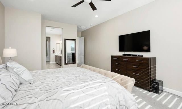 bedroom featuring ceiling fan and ensuite bath