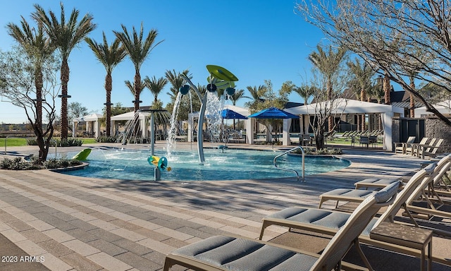 view of pool with pool water feature