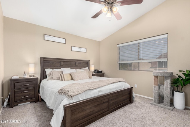 bedroom featuring ceiling fan, light colored carpet, and vaulted ceiling