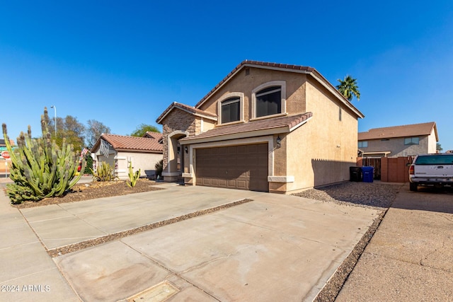 mediterranean / spanish-style home featuring a garage