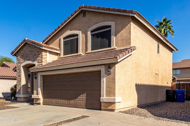 view of front of home with a garage