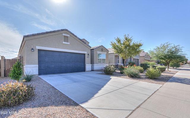 ranch-style house featuring a garage