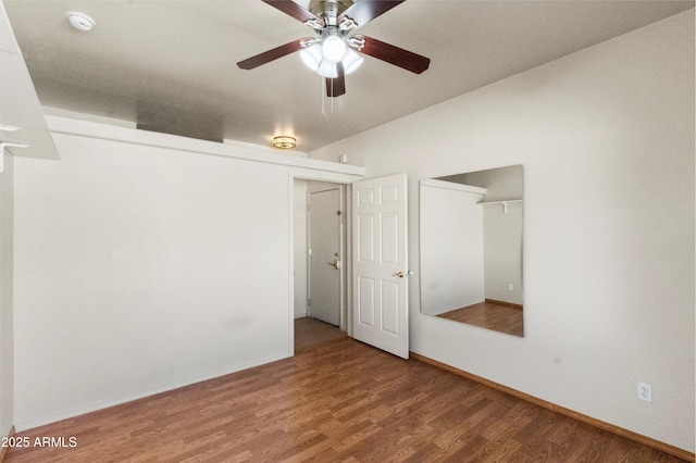 unfurnished bedroom with ceiling fan and hardwood / wood-style floors