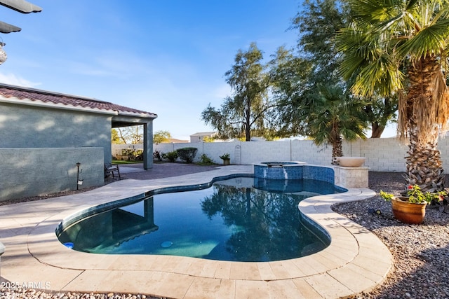 view of swimming pool with an in ground hot tub and a patio