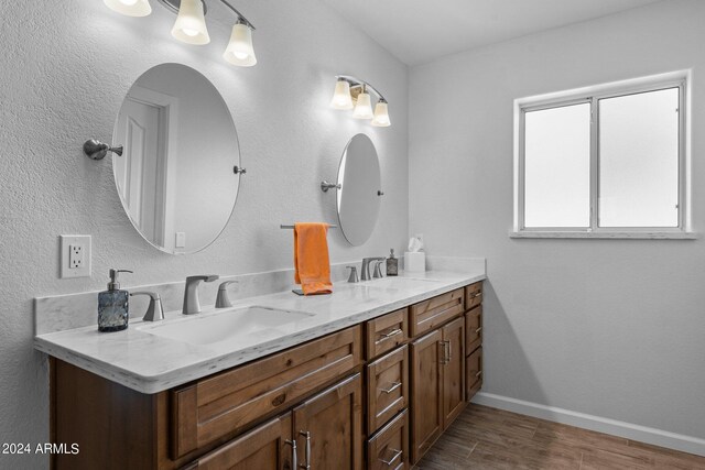 bathroom featuring vanity and hardwood / wood-style flooring