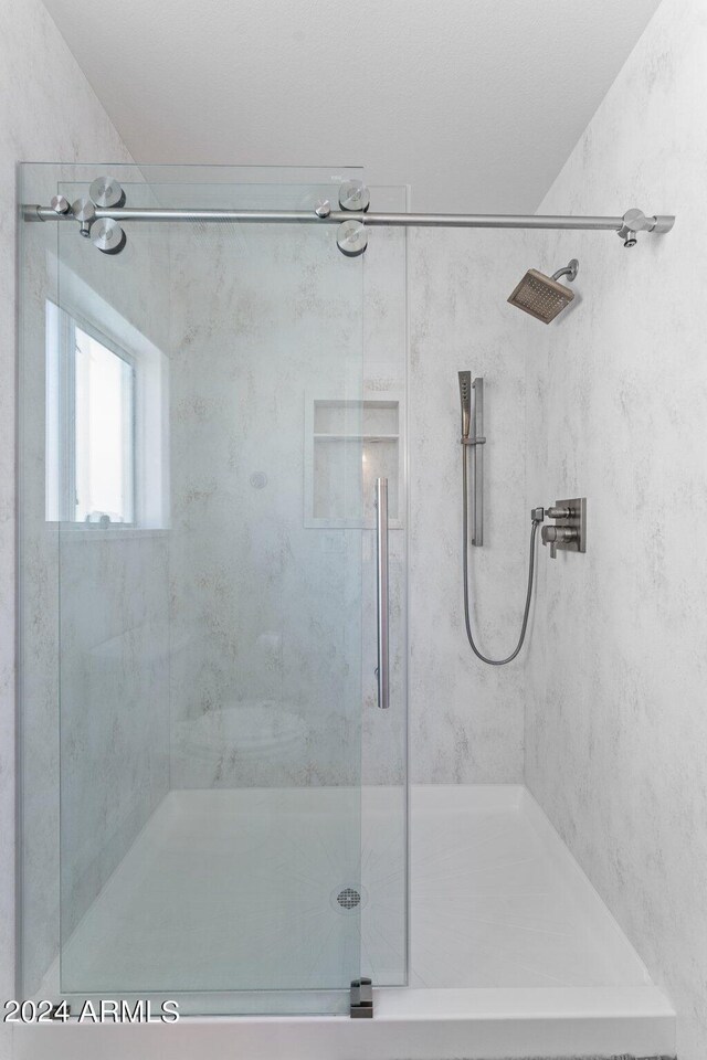 bathroom with an enclosed shower