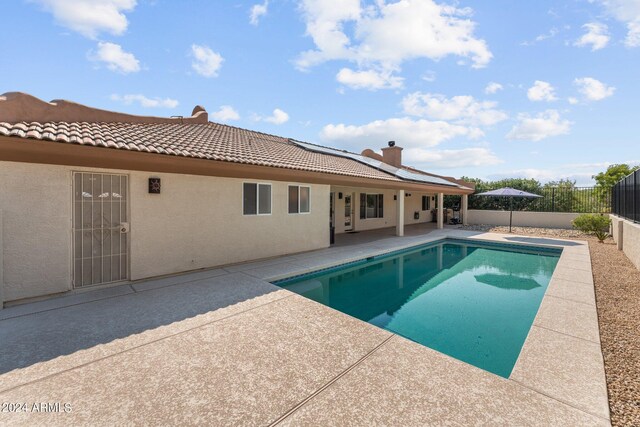 view of swimming pool with a patio area