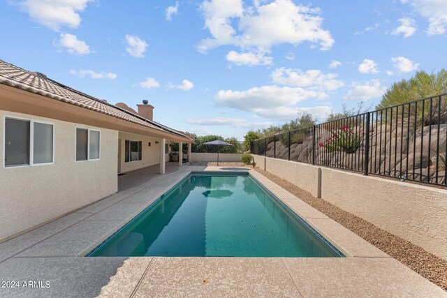 view of pool featuring a patio