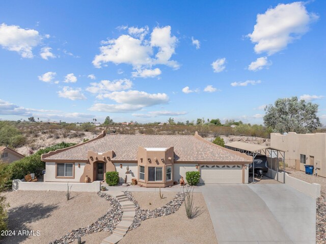 southwest-style home featuring a garage