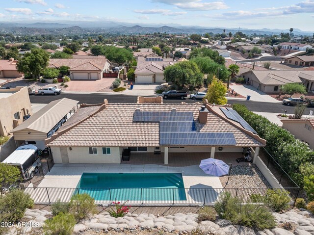 view of swimming pool with a patio and a mountain view