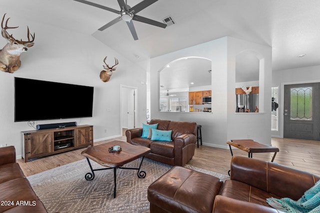 living room with plenty of natural light, light hardwood / wood-style flooring, and ceiling fan