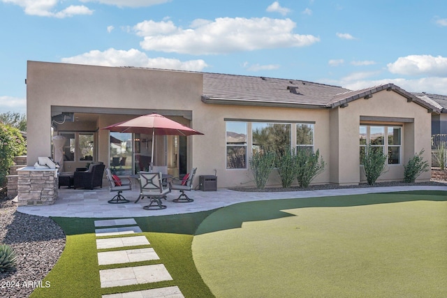 back of house featuring a patio area