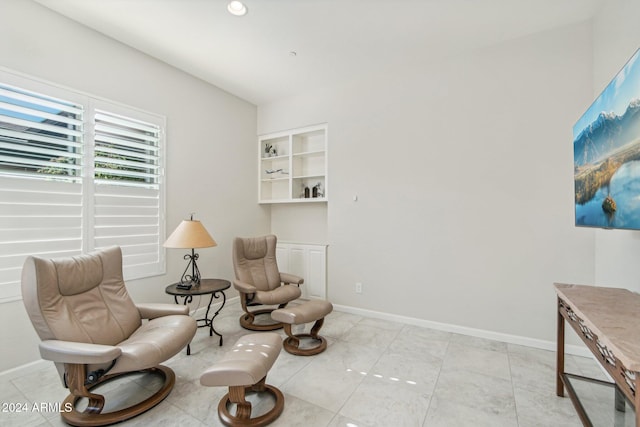 sitting room with built in shelves