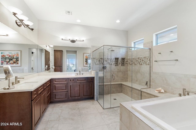 bathroom featuring separate shower and tub, tile patterned flooring, and vanity