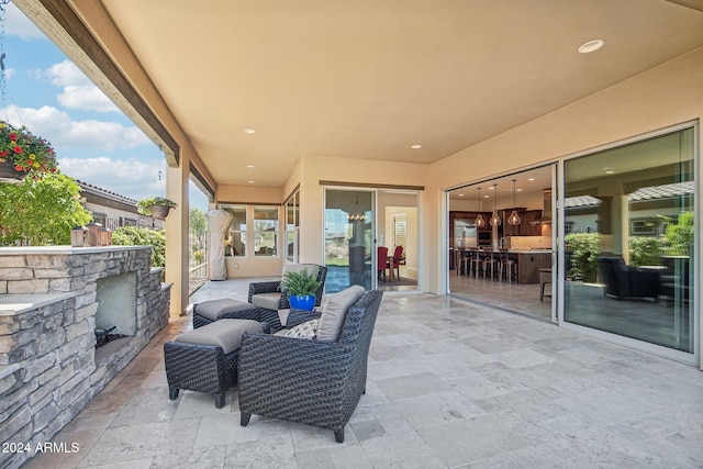 view of patio / terrace featuring an outdoor living space with a fireplace