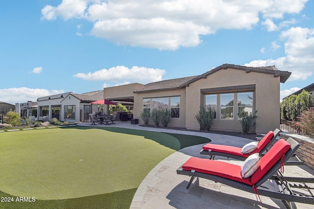 rear view of house featuring a patio area