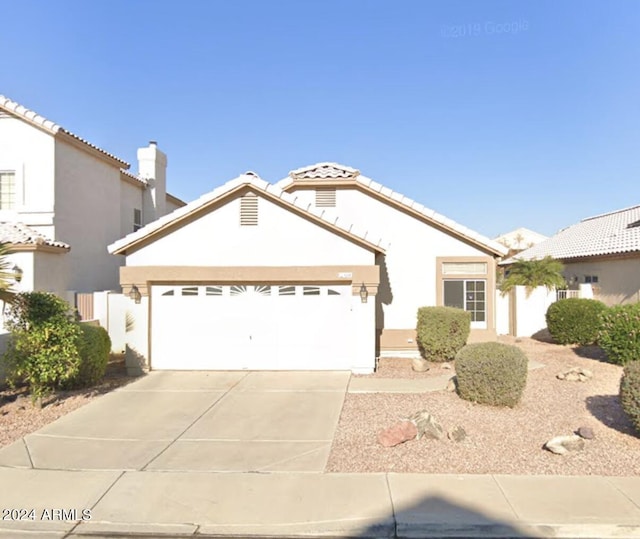 view of front of property with a garage