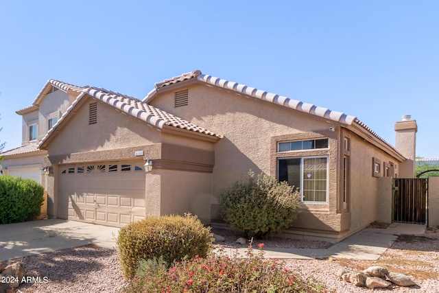 view of front of property with a garage