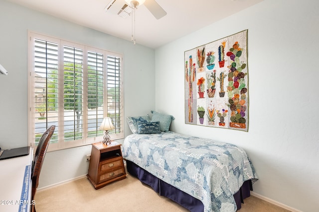 bedroom featuring light carpet and ceiling fan