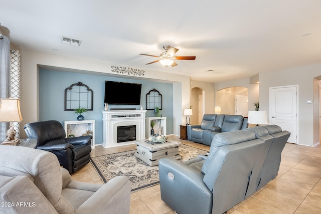 living room with light tile patterned floors and ceiling fan