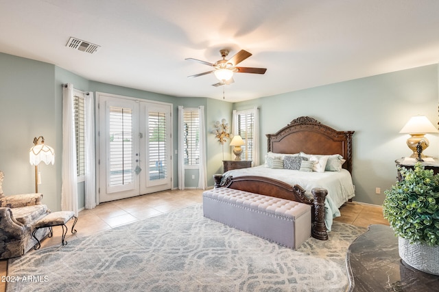 tiled bedroom with french doors, ceiling fan, and access to exterior