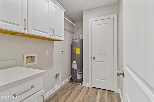 clothes washing area featuring washer hookup, hookup for an electric dryer, light hardwood / wood-style flooring, cabinets, and electric water heater