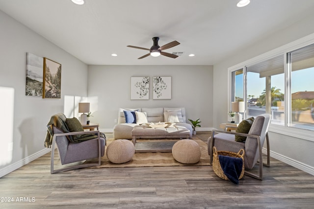 interior space featuring wood-type flooring and ceiling fan