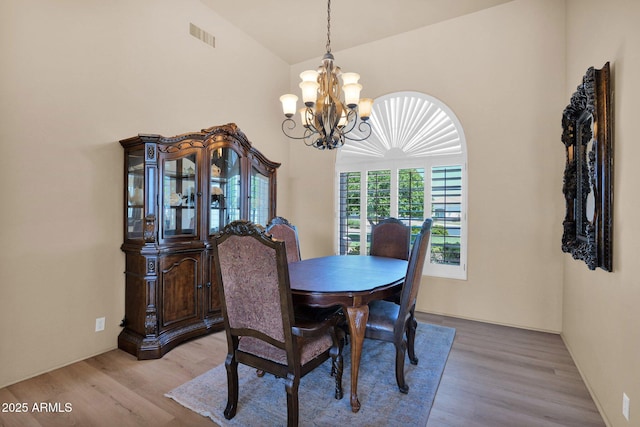 1940 N Stevens Cir, Mesa, AZ 85205 - dining space with a chandelier, light wood-style floors, and high vaulted ceiling