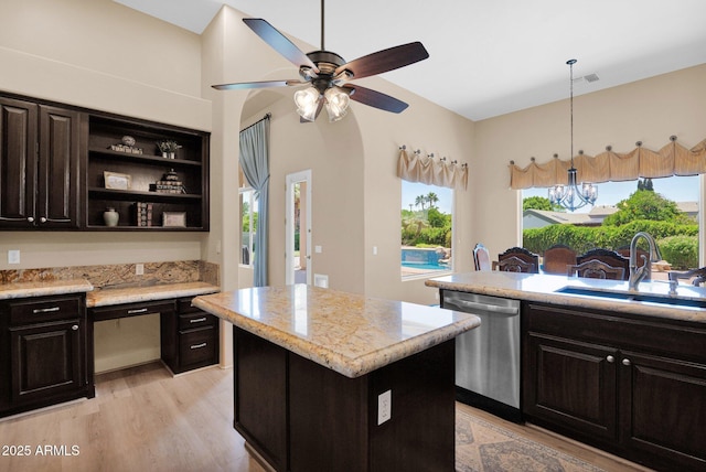1940 N Stevens Cir, Mesa, AZ 85205 - kitchen featuring dishwasher, a kitchen island, light wood-style flooring, and open shelves