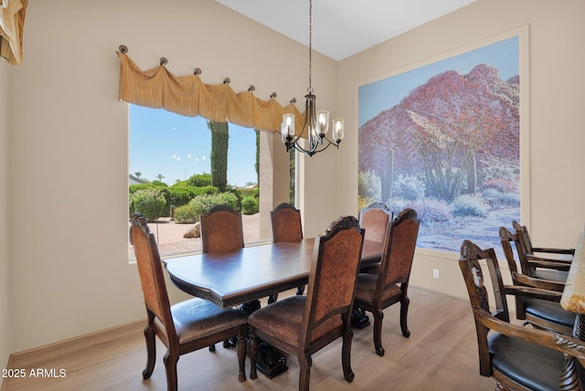 1940 N Stevens Cir, Mesa, AZ 85205 - dining area featuring a chandelier and light wood-style floors