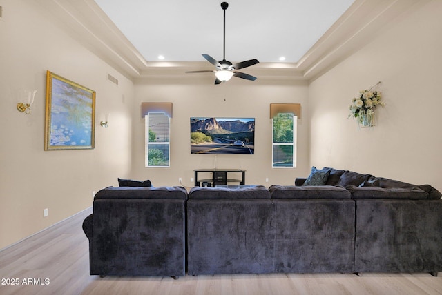 1940 N Stevens Cir, Mesa, AZ 85205 - living area with wood finished floors, a tray ceiling, ceiling fan, and recessed lighting