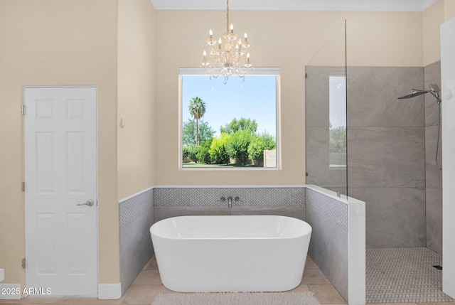 1940 N Stevens Cir, Mesa, AZ 85205 - full bath with a soaking tub, a walk in shower, a chandelier, tile patterned floors, and a wainscoted wall