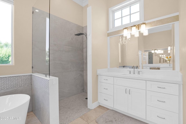1940 N Stevens Cir, Mesa, AZ 85205 - bathroom featuring walk in shower, a freestanding tub, vanity, tile patterned floors, and a chandelier