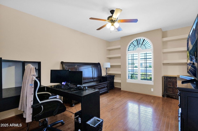 1940 N Stevens Cir, Mesa, AZ 85205 - office area with wood finished floors, built in shelves, and ceiling fan
