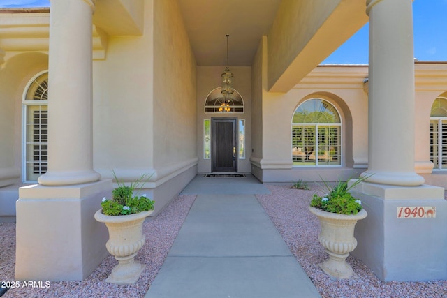 1940 N Stevens Cir, Mesa, AZ 85205 - doorway to property featuring stucco siding and a porch