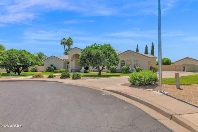 1940 N Stevens Cir, Mesa, AZ 85205 - obstructed view of property featuring curved driveway and stucco siding