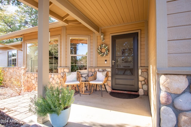 entrance to property featuring a porch