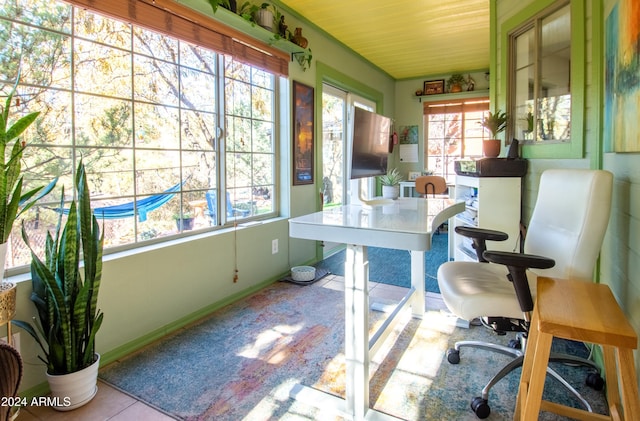 tiled office featuring a healthy amount of sunlight