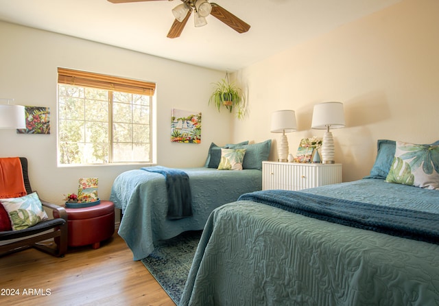 bedroom featuring ceiling fan and light hardwood / wood-style flooring