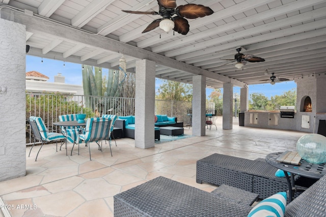 view of patio featuring a grill, outdoor lounge area, and exterior kitchen