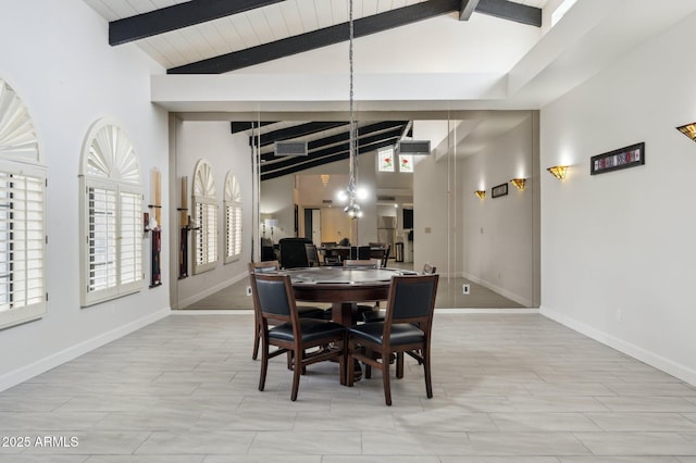 dining room with high vaulted ceiling, beam ceiling, and light hardwood / wood-style floors