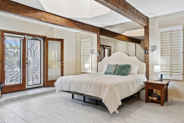 bedroom featuring beamed ceiling and access to outside