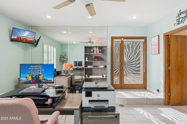 office space with light tile patterned floors and ceiling fan