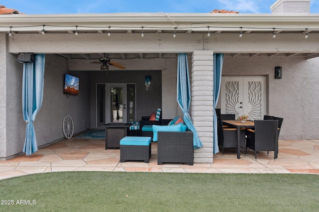 view of patio with french doors and ceiling fan