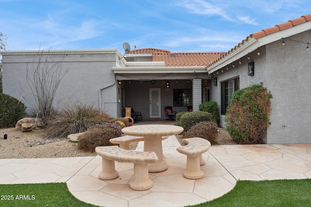 property entrance featuring a patio area