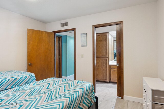 bedroom featuring connected bathroom