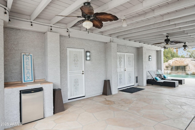 view of patio / terrace featuring ceiling fan