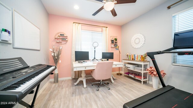 home office with ceiling fan and light hardwood / wood-style flooring